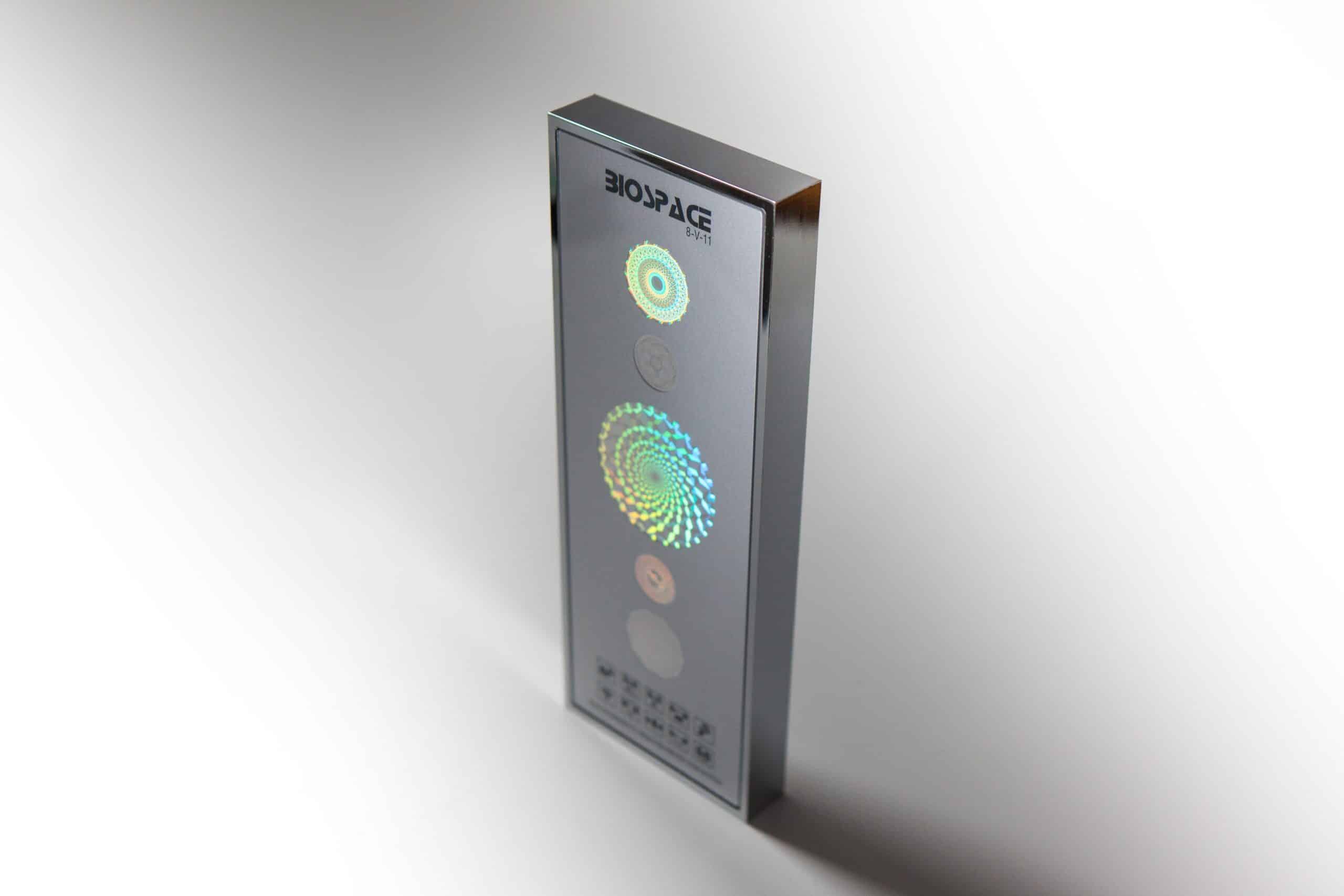 BioSpace 8V11 Diamond is a sleek device with a metallic finish, featuring three circular light patterns in varying colors on its front panel. The brand name "BIOPAGE" is displayed at the top, and the base shows a control interface.