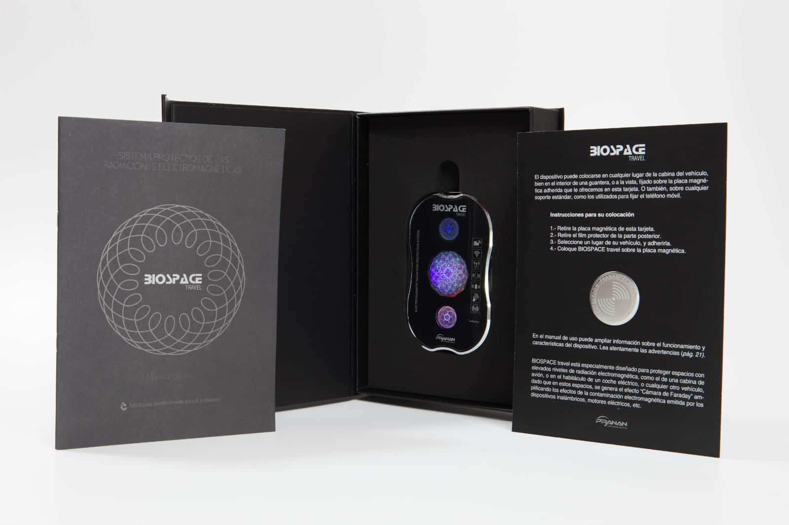 BioSpace Travel Diamond is presented in a sleek black packaging with a magnetic closure, featuring intricate violet and purple circular designs on the device. The interior includes detailed descriptions and showcases the device prominently.