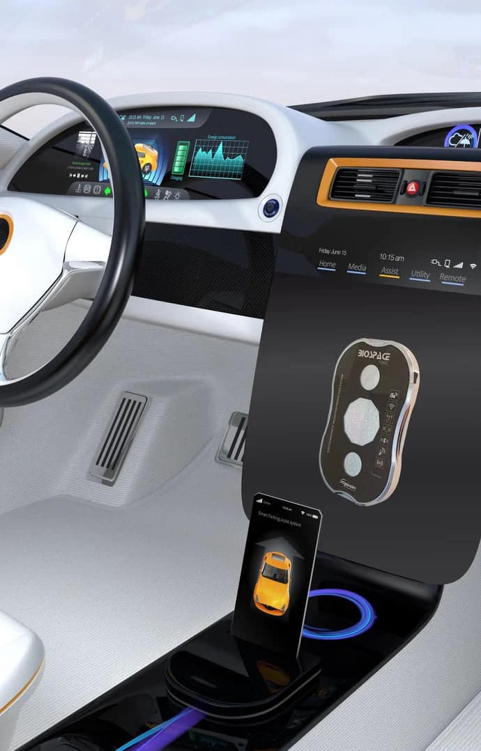 BioSpace Travel Diamond in silver and gold finish, shown on a sleek car dashboard next to a smartphone. The device features a central control interface with buttons and a screen, integrated into a modern vehicle setting.