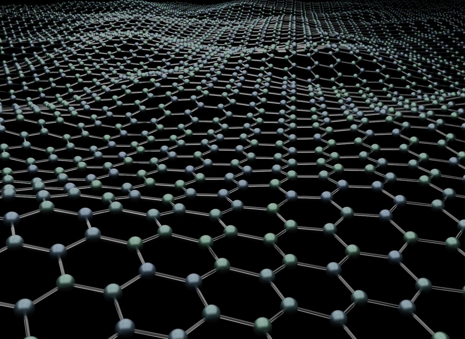 A close-up view of a molecular structure depicting a grid-like arrangement of interconnected atoms. The hexagonal pattern is composed of small spheres representing atoms, with varying colors, set against a dark background.