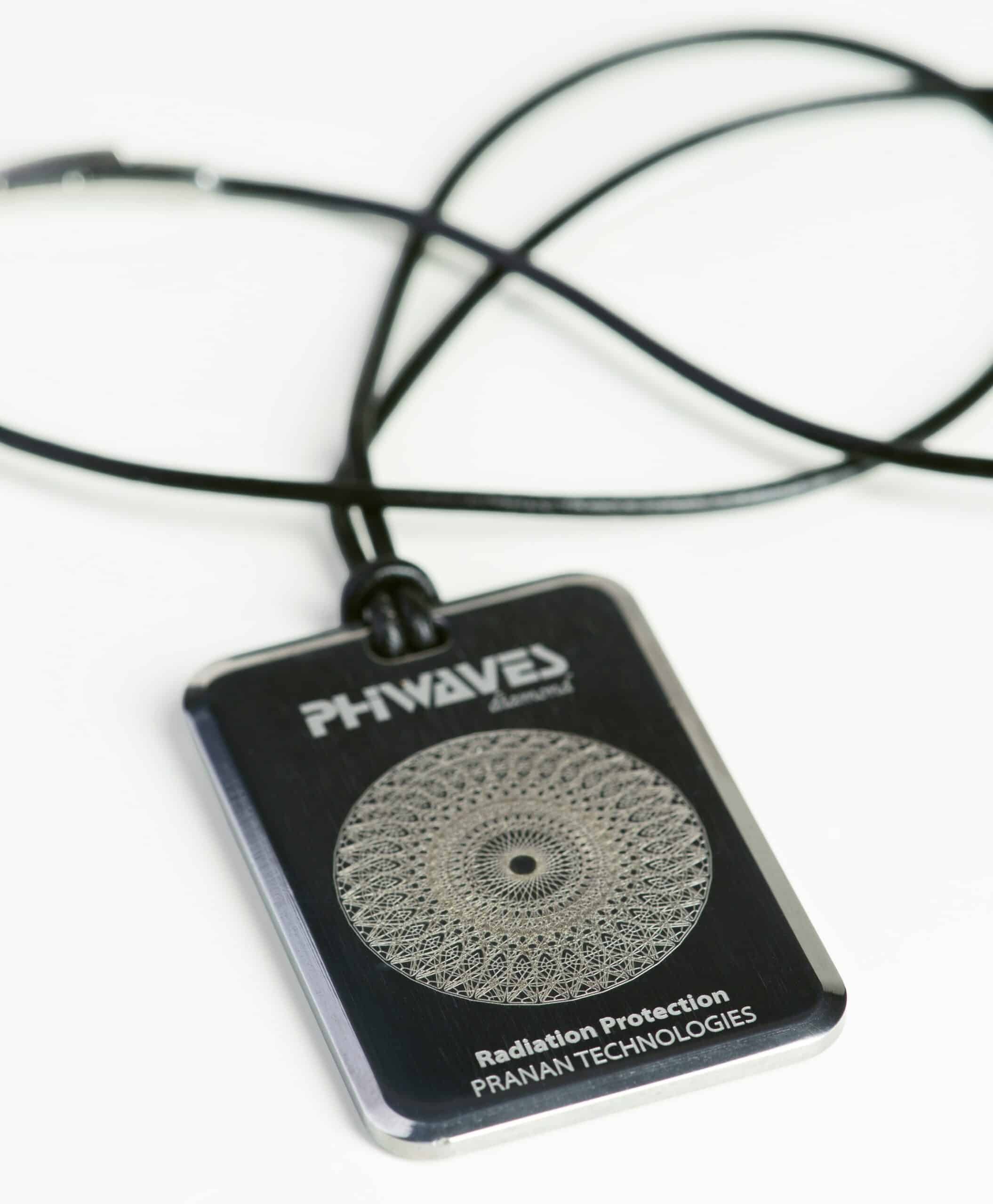 PhiWaves Pendant Diamond by Pranan Technologies, featuring a circular design with intricate details, displayed on a black cord necklace. The pendant is designed for radiation protection.